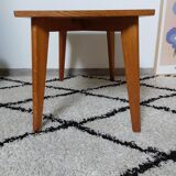 Coffee table with wooden compass legs
