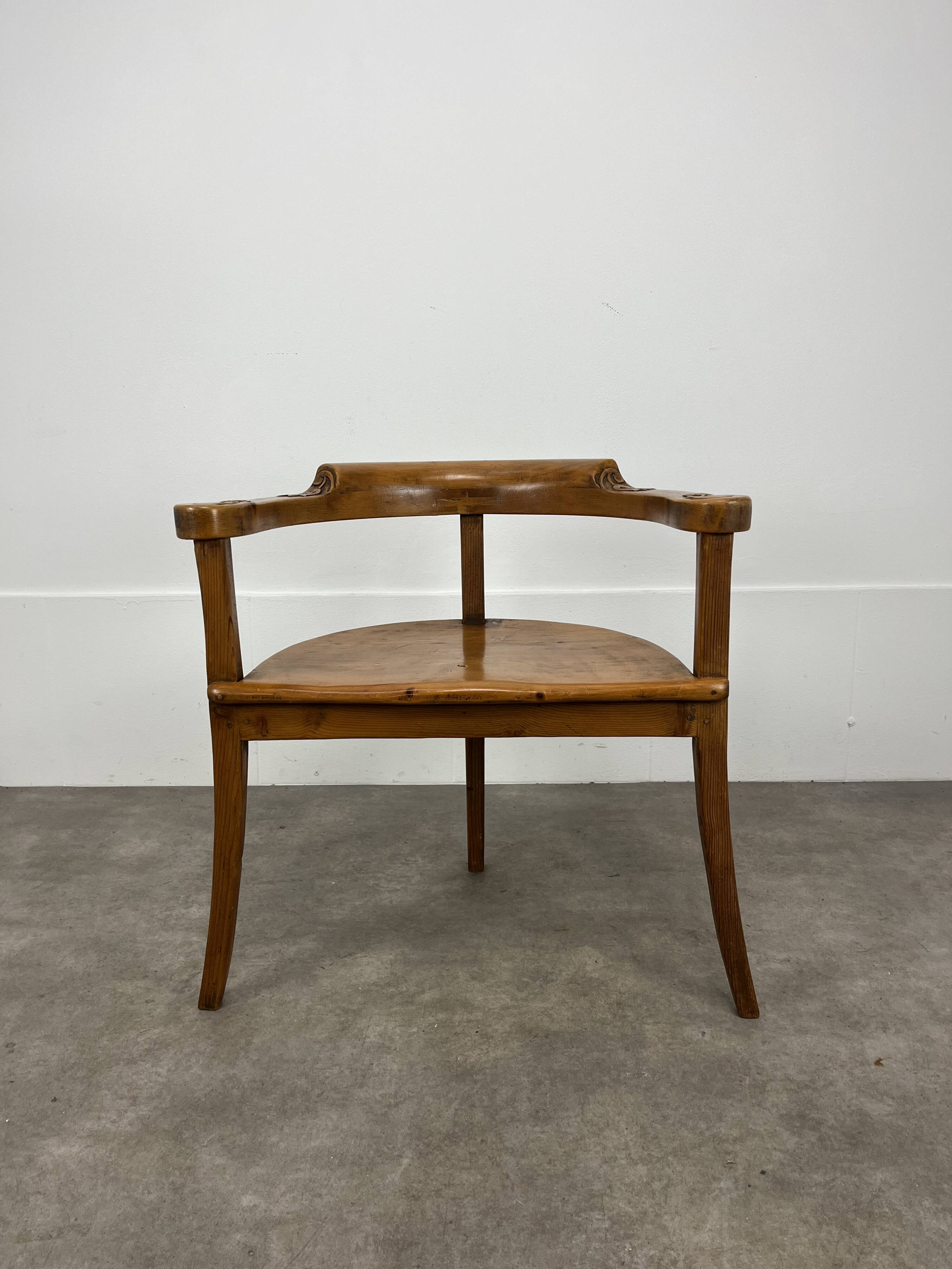 Chalet-style carved wooden tripod armchair