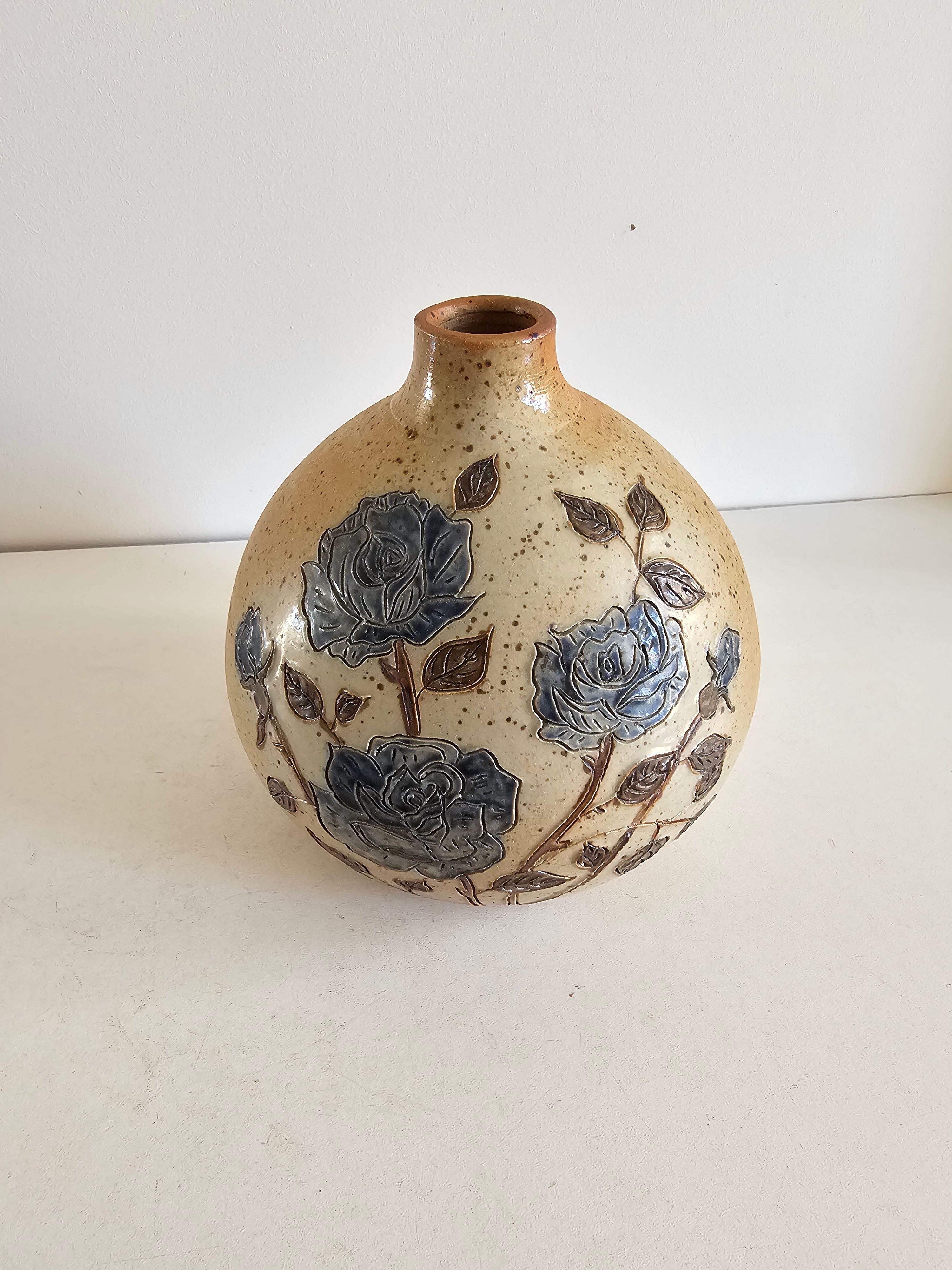 Ceramic lamp base with floral pattern, signed.