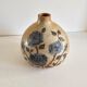 Ceramic lamp base with floral pattern, signed.