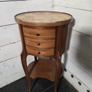Oval bedside table in Louis XV style made of mahogany.