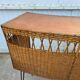 Vintage 1950s bar counter with its two rattan and metal stools.