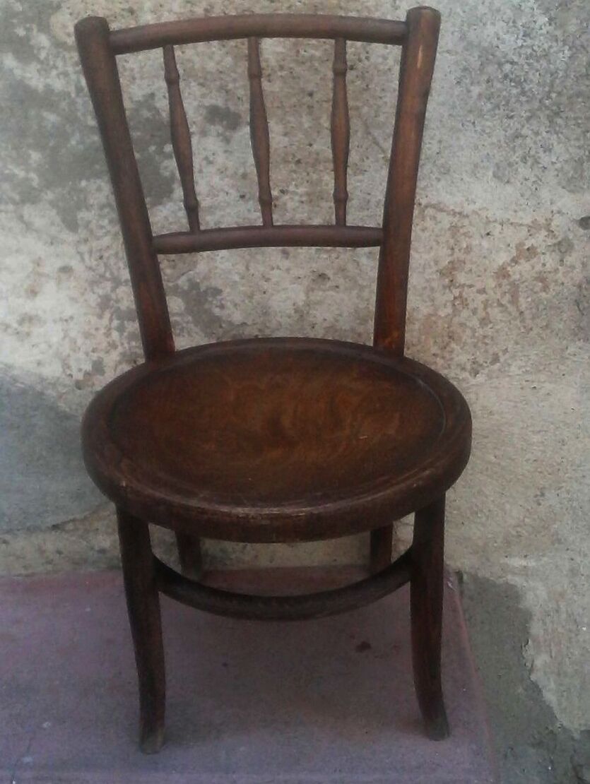 Antique children's chair in curved wood