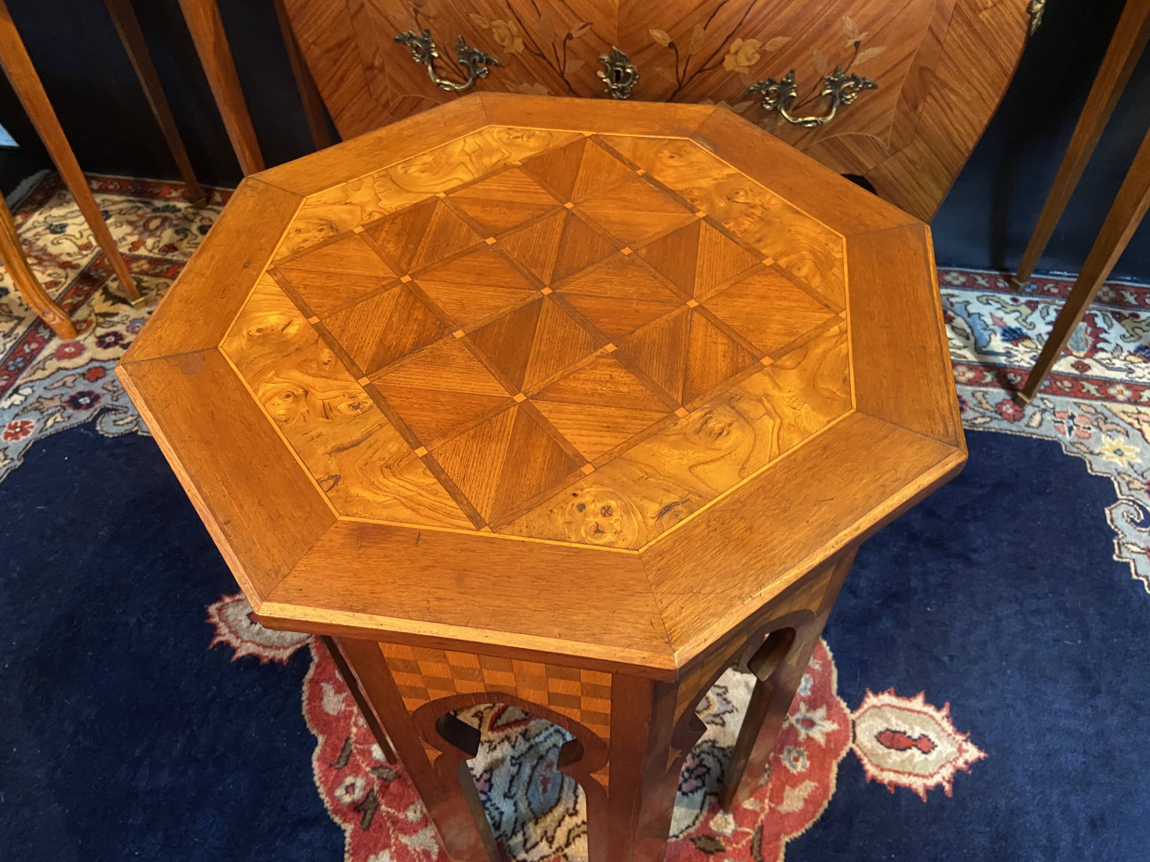 Thuyawood tea table with marquetry decoration.