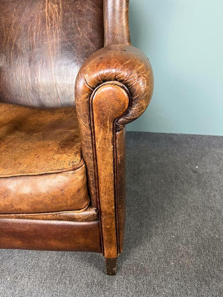 Vintage armchair in patinated sheep leather