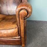 Vintage armchair in patinated sheep leather