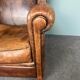 Fauteuil vintage en cuir de mouton patiné