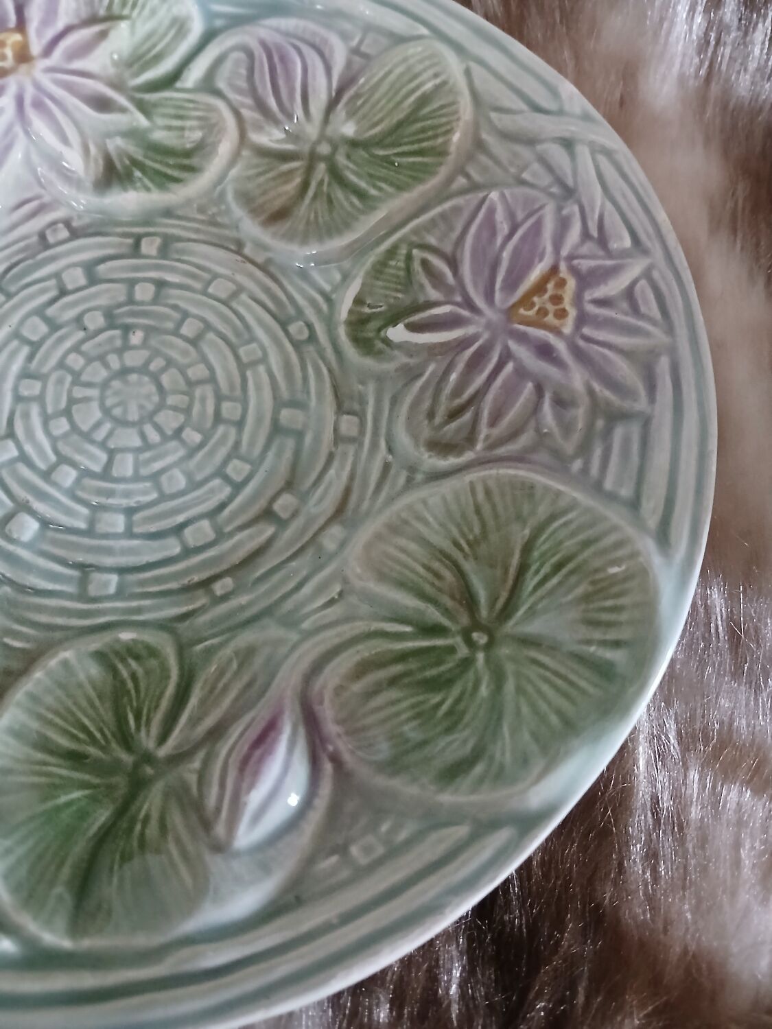 Antique cup and saucer in majolica.