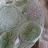 Antique cup and saucer in majolica.