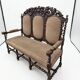 Three-seater armchair in Louis XIII style made of oak from the 19th century.