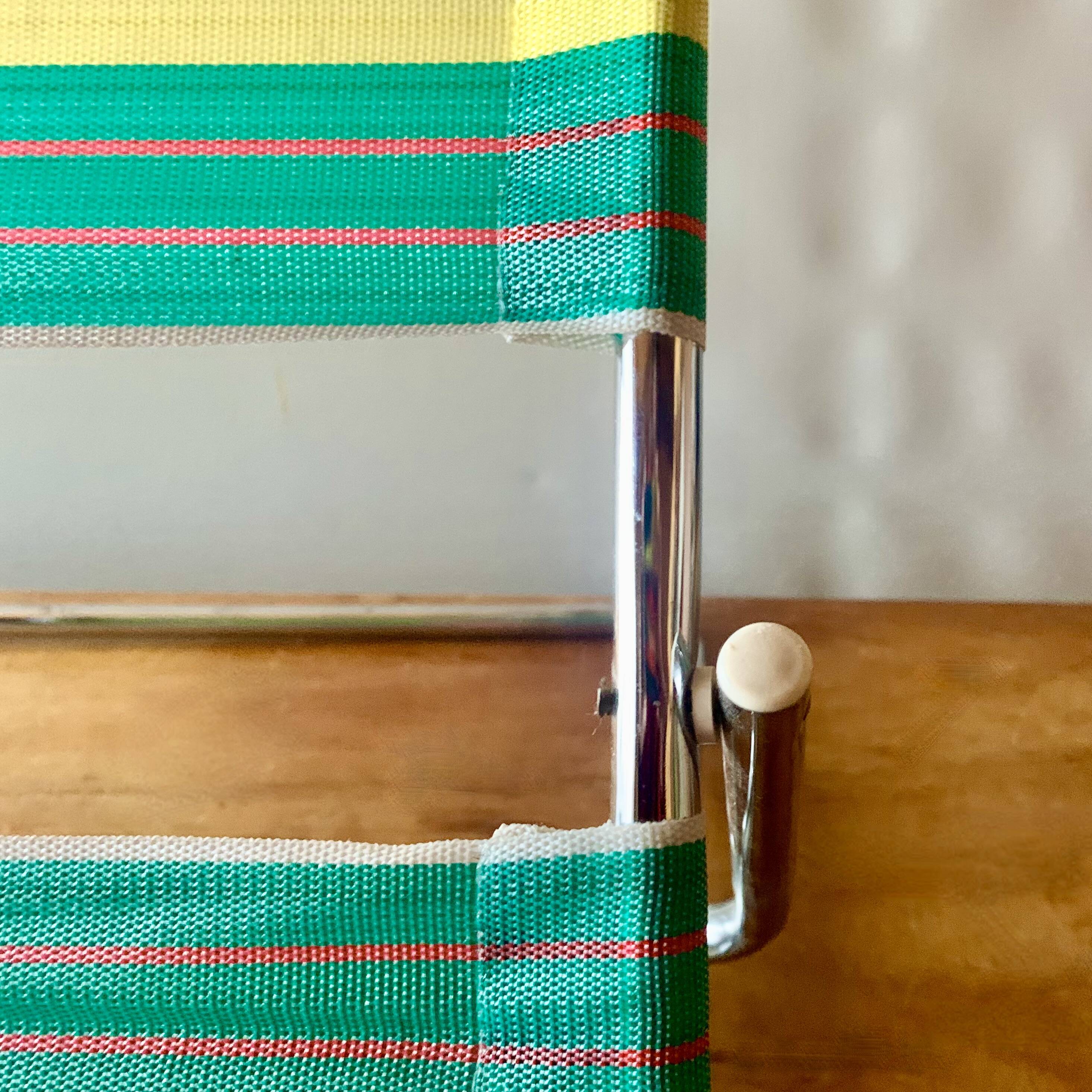 Vintage folding beach chair in chrome metal and woven plastic