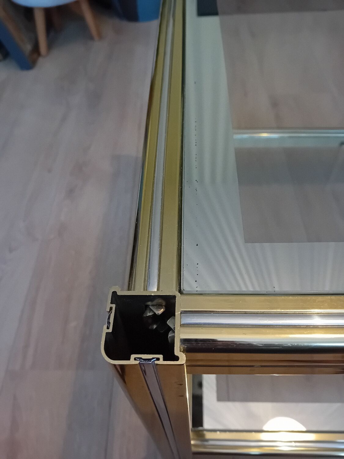 Glass and golden brass coffee table