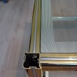 Glass and golden brass coffee table