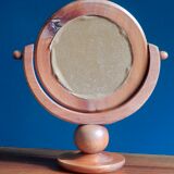 Round mirror psyche of wooden table