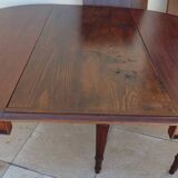 Extendable mahogany table with 6 tapered and fluted legs, Louis XVI style