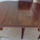 Table en acajou extensible  à 6 pieds fuselés et canelé style louis XVI