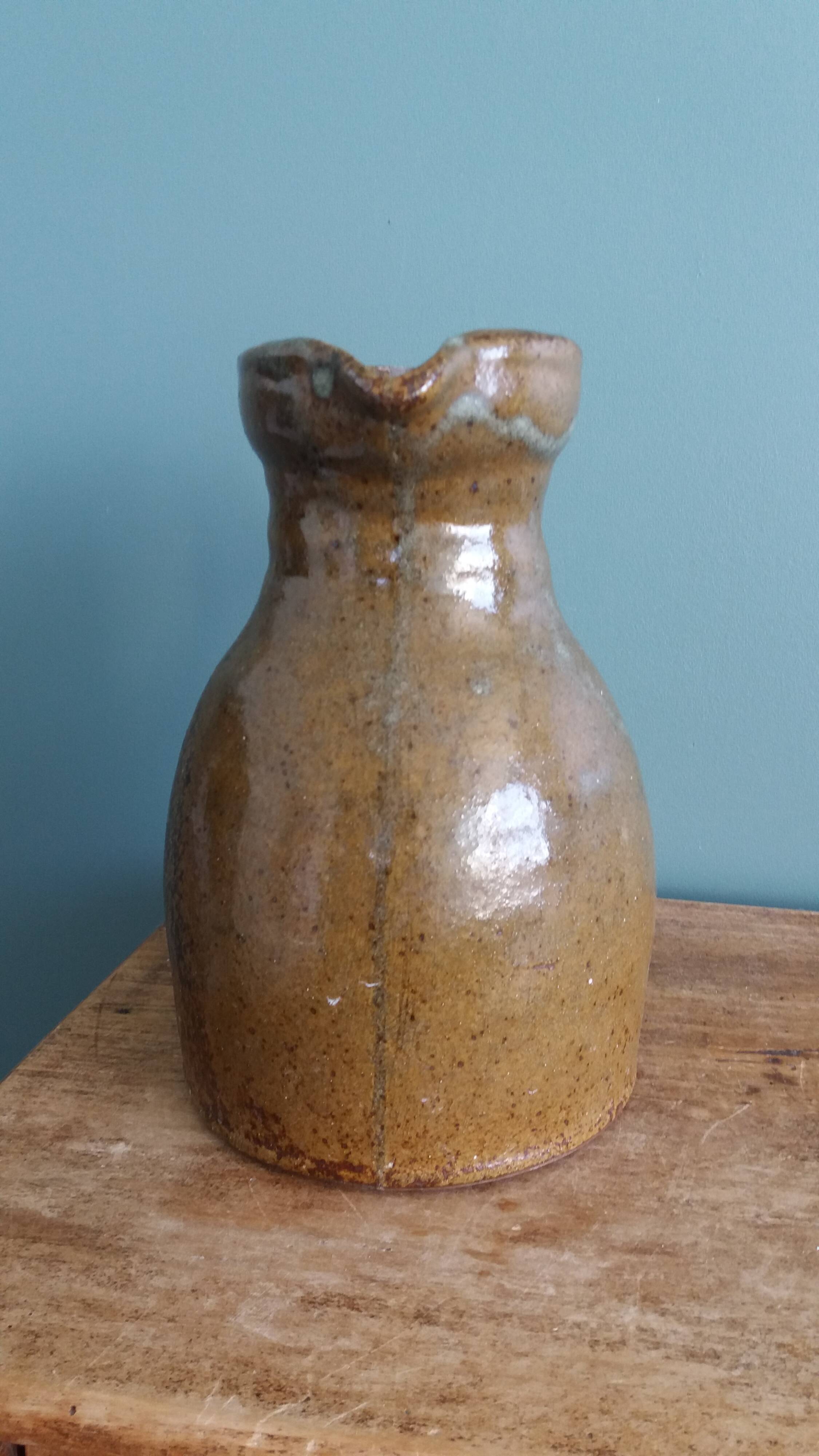Rustic stoneware jug, chic countryside.