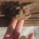 Natural wood pediment with bunches of grapes