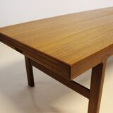 Table basse en teck avec feuille d'extension noire, design danois, années 1960.