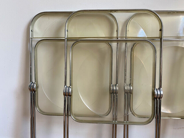 Four Plia folding chairs by Giancarlo Piretti edited by Castelli