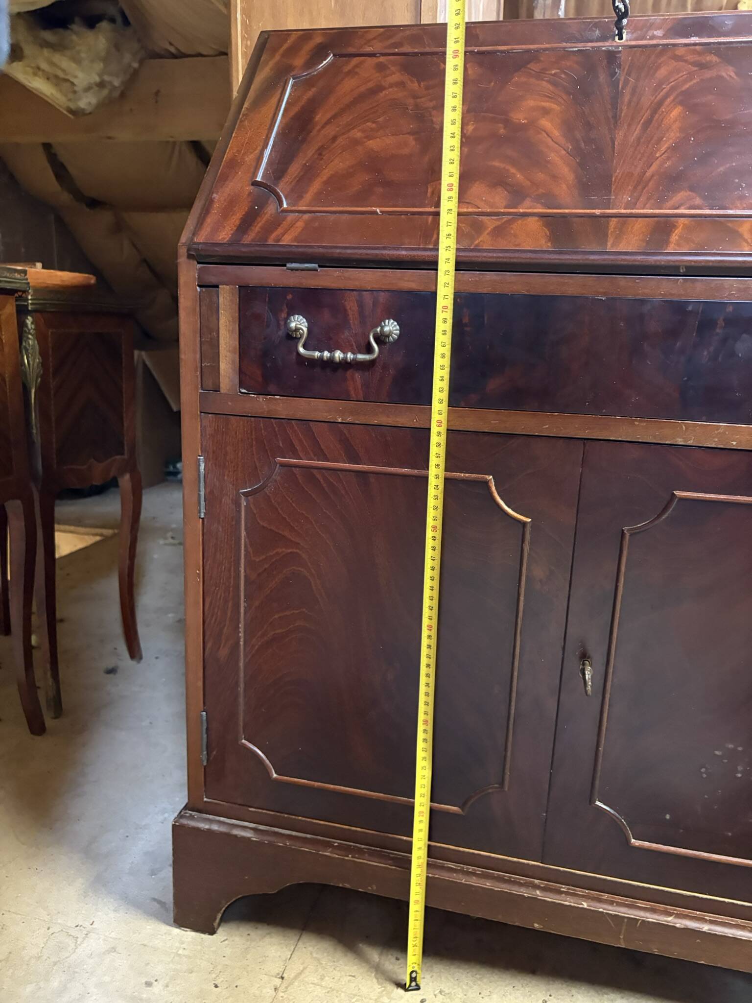 Antique mahogany secretary, upholstered flap and interior storage