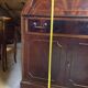 Antique mahogany secretary, upholstered flap and interior storage