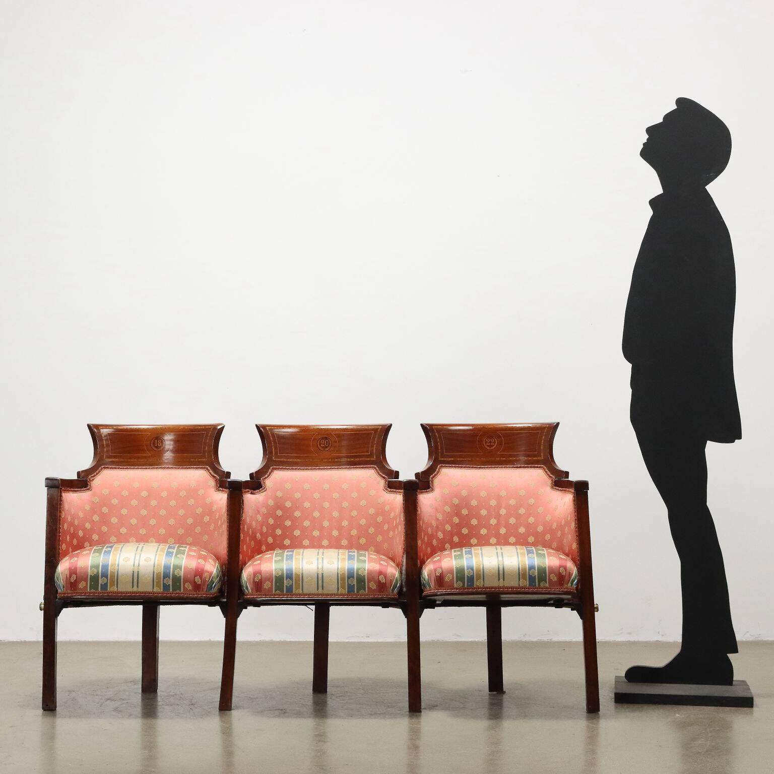 Three vintage cinema or theatre armchairs