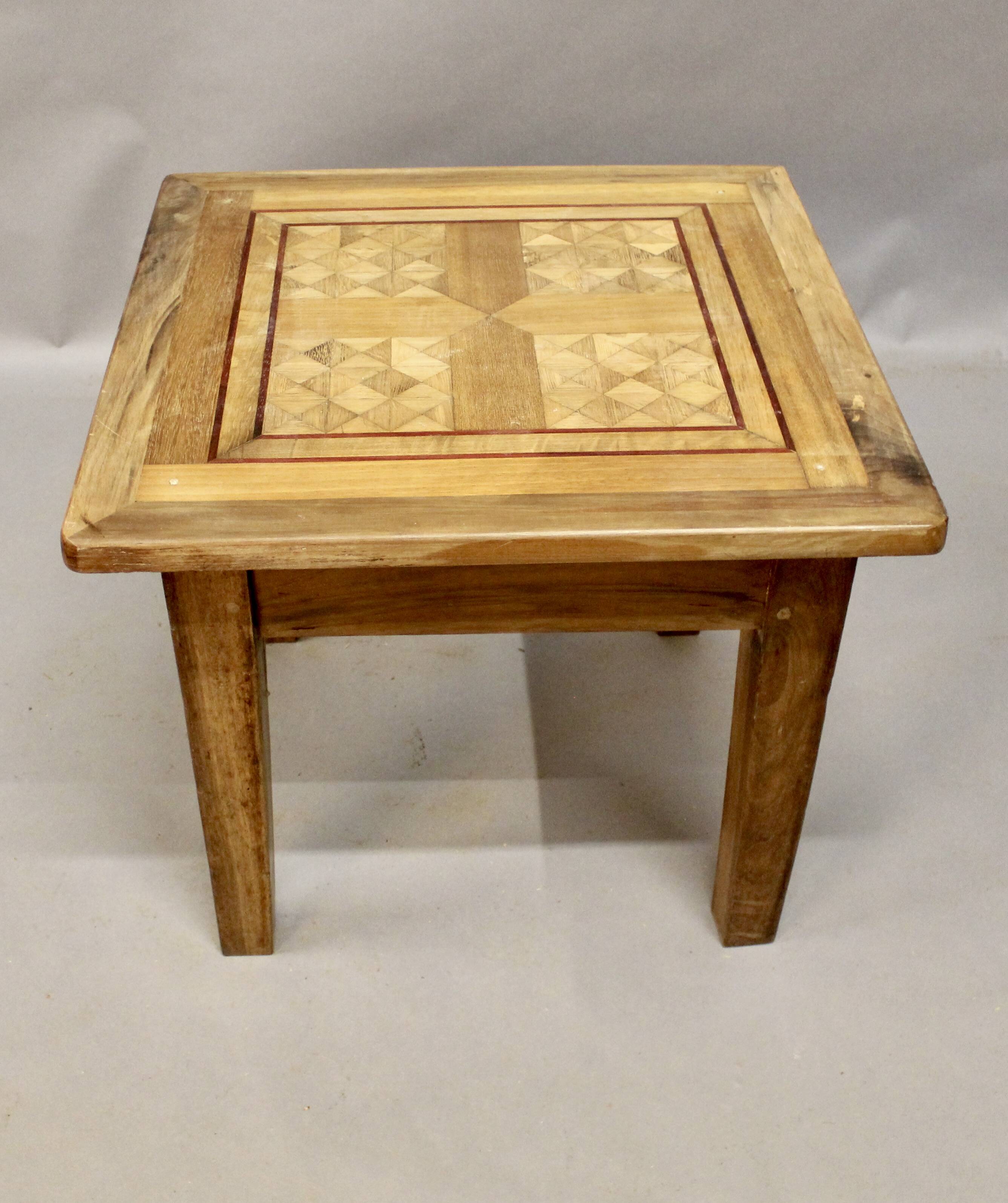 Coffee table on old parquet floor with marquetry
