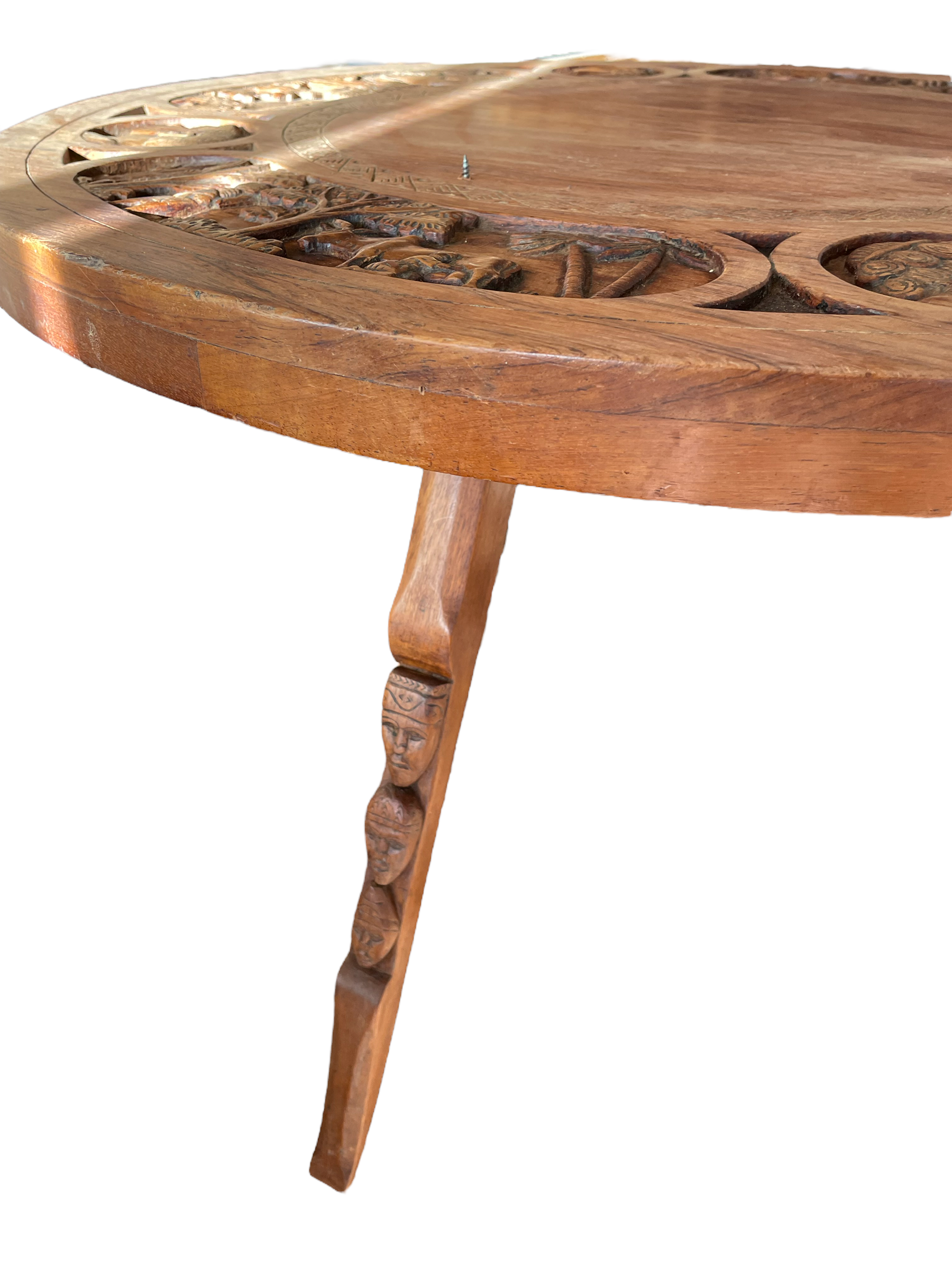 Circular tripod coffee table in carved wood
