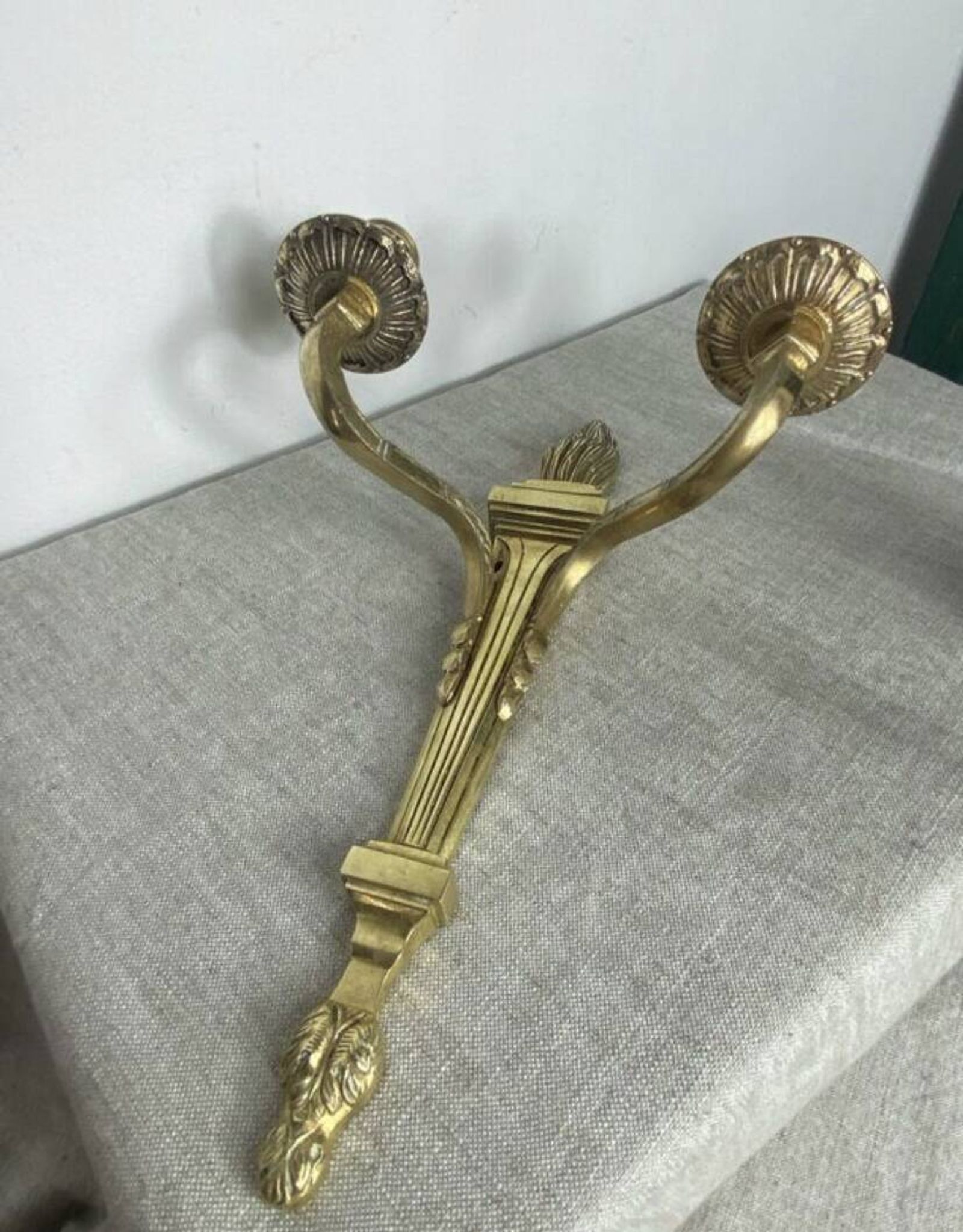 Pair of wall candle holders in bronze