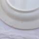 Set of 4 white and blue dinner plates.