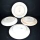 Onnaing Faïencerie set of 4 Coppelia plates with green floral decoration, iron earthenware