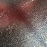 Black leather three-seater sofa