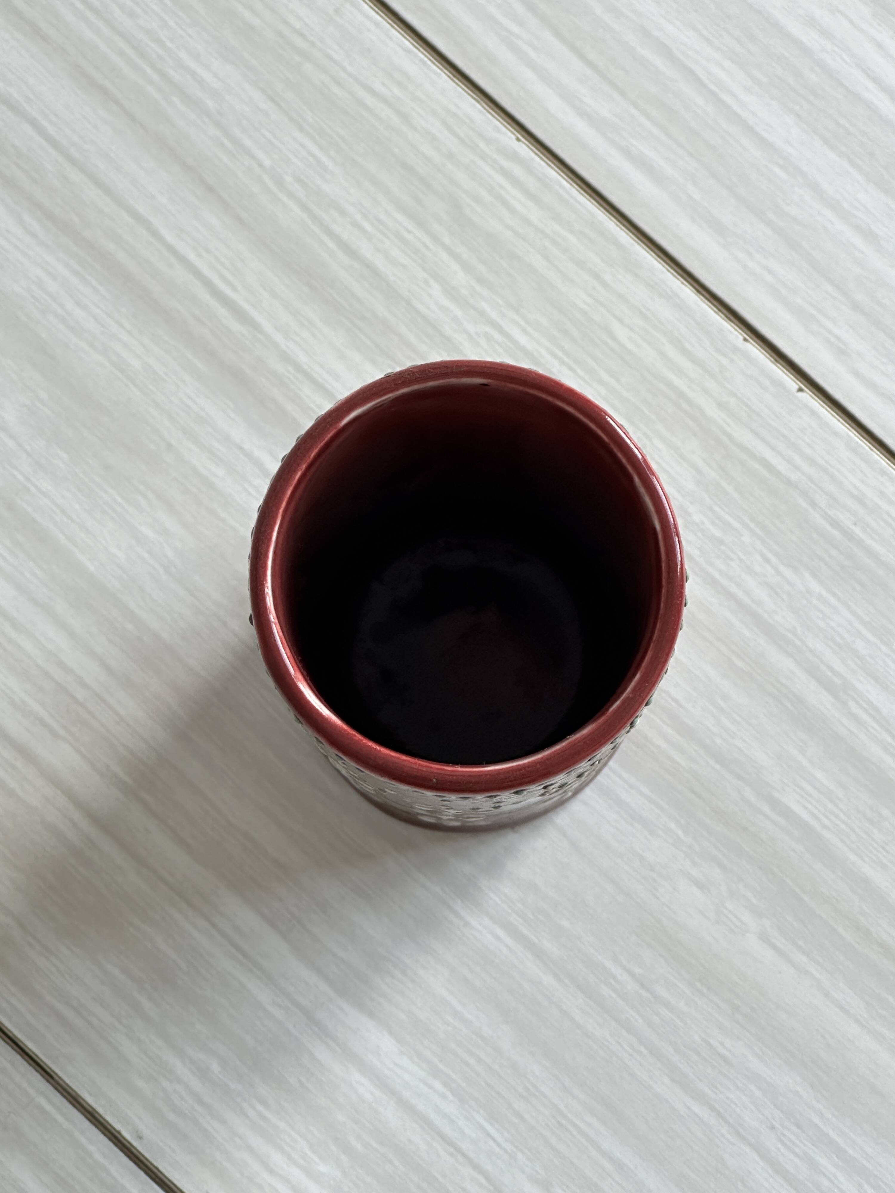 Small antique roller vase in red enamelled ceramic