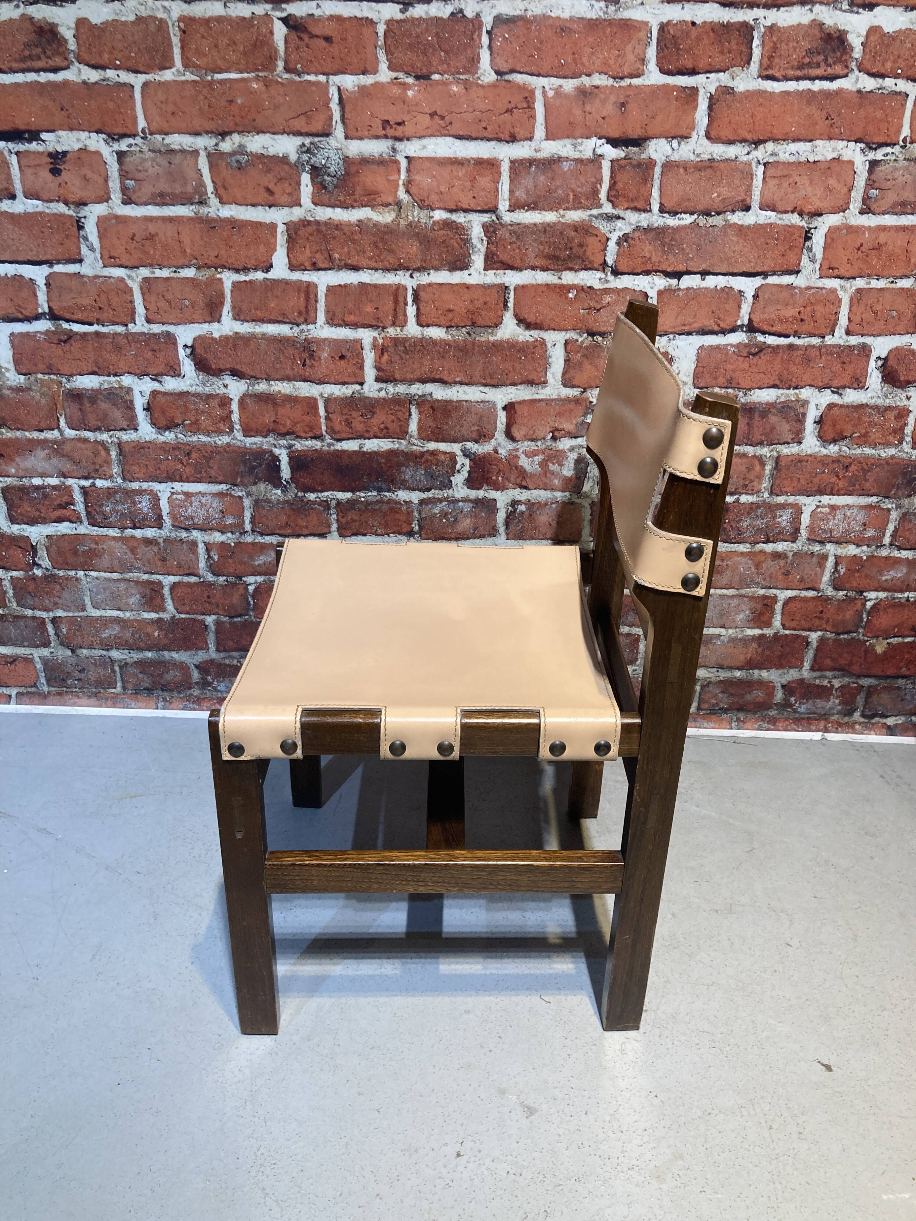 Set of four wooden and leather chairs from Maison Regain