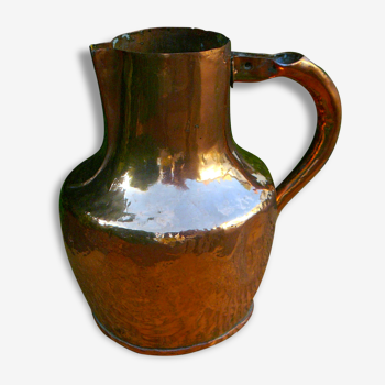 Decorative old copper pitcher