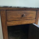 Vintage bedside table in the shape of a wooden column and a gray marble top
