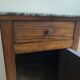 Vintage bedside table in the shape of a wooden column and a gray marble top