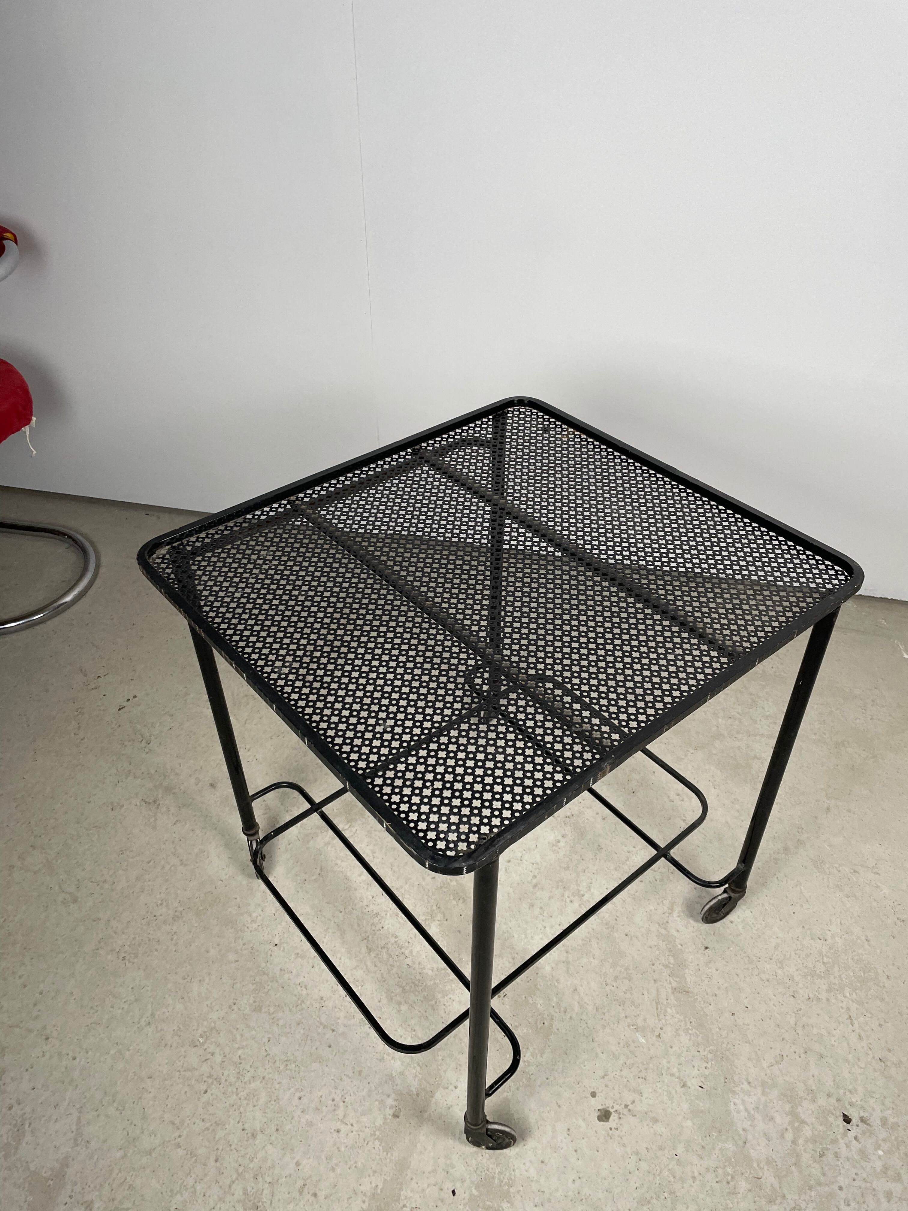 Trolley in perforated sheet metal