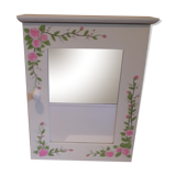 White mirrored toilet cabinet with floral pattern