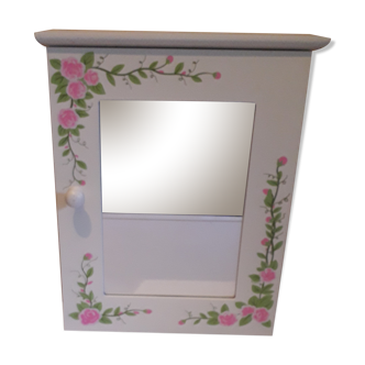 White mirrored toilet cabinet with floral pattern