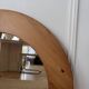 Round Scandinavian pine mirror from the 1970s.