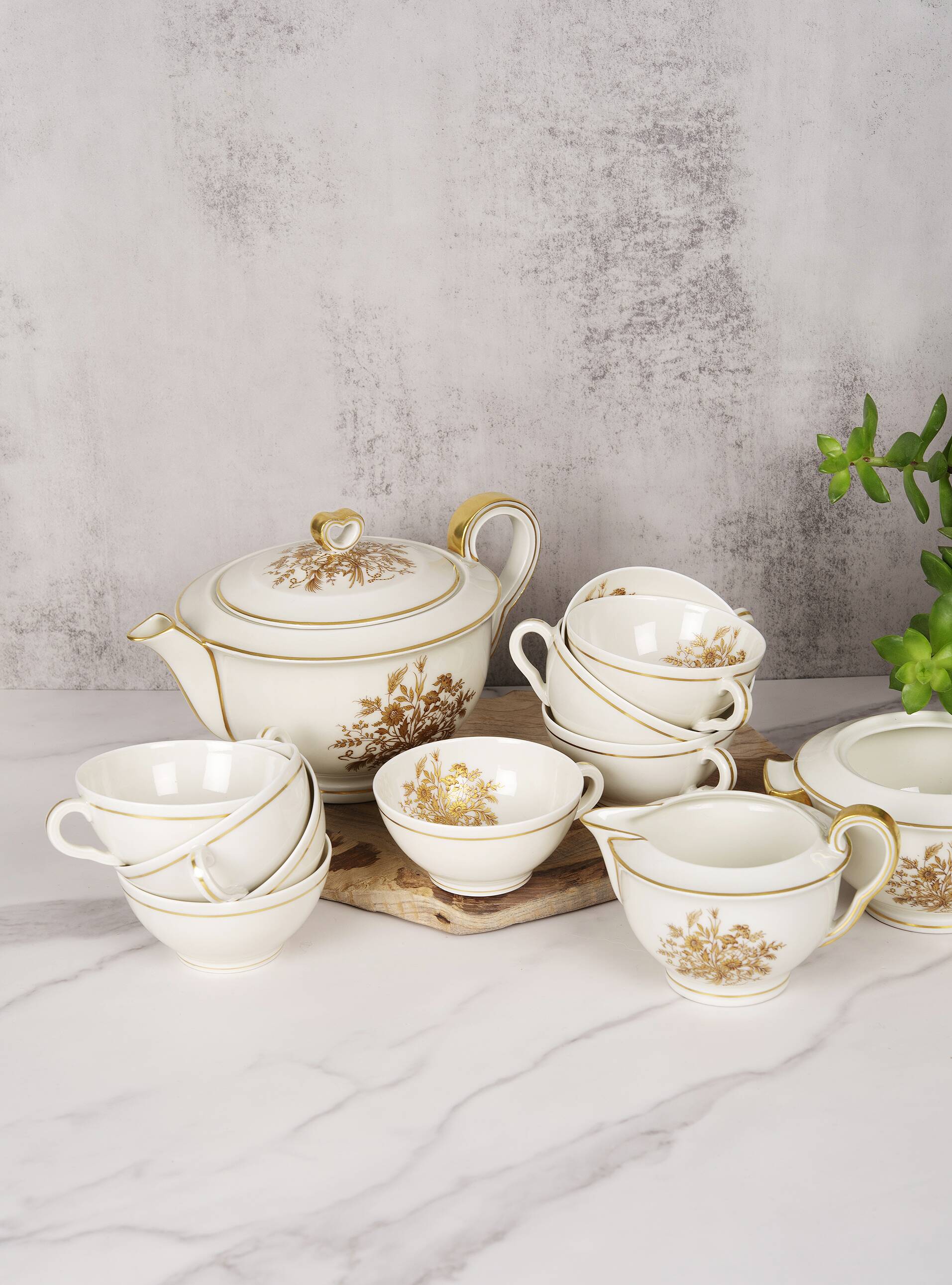 Porcelain tea service by Théodore Haviland, gilded patterns.