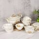 Porcelain tea service by Théodore Haviland, gilded patterns.