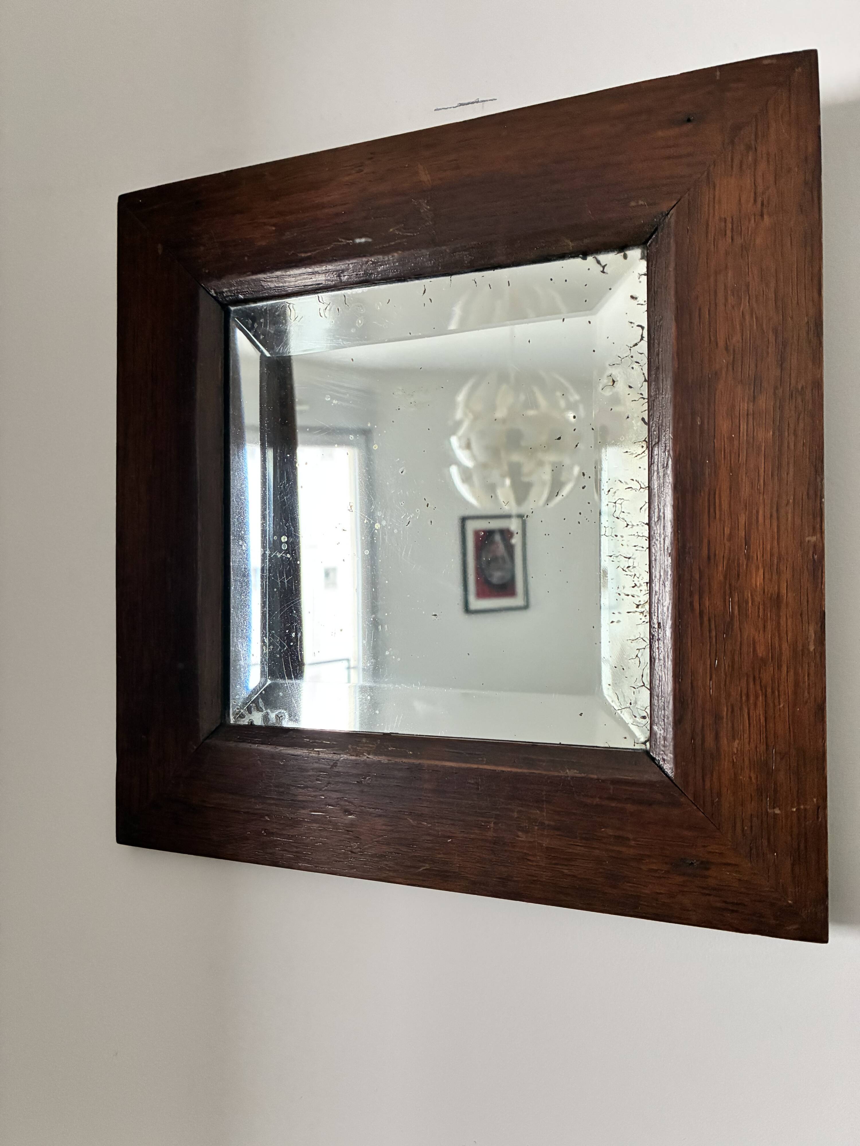 Bevelled mercury mirror with a wooden frame
