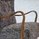 1960s, reupholstered Danish armchair, with stool, genuine sheepskin.