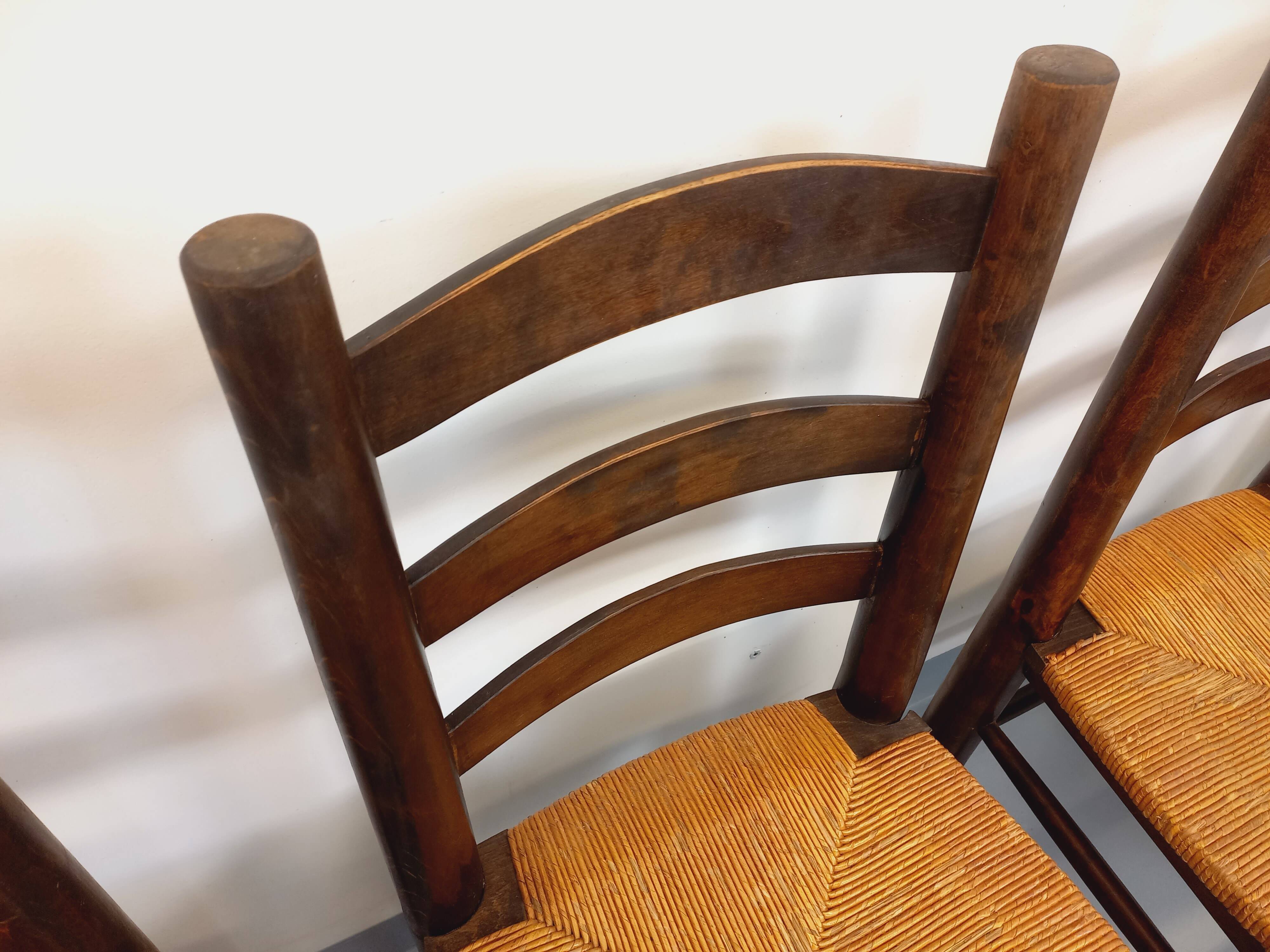 Set of 4 vintage brutalist chairs by Georges Robert in wood and straw.