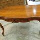Curved desk in Louis XV style, made of carved and moulded walnut.