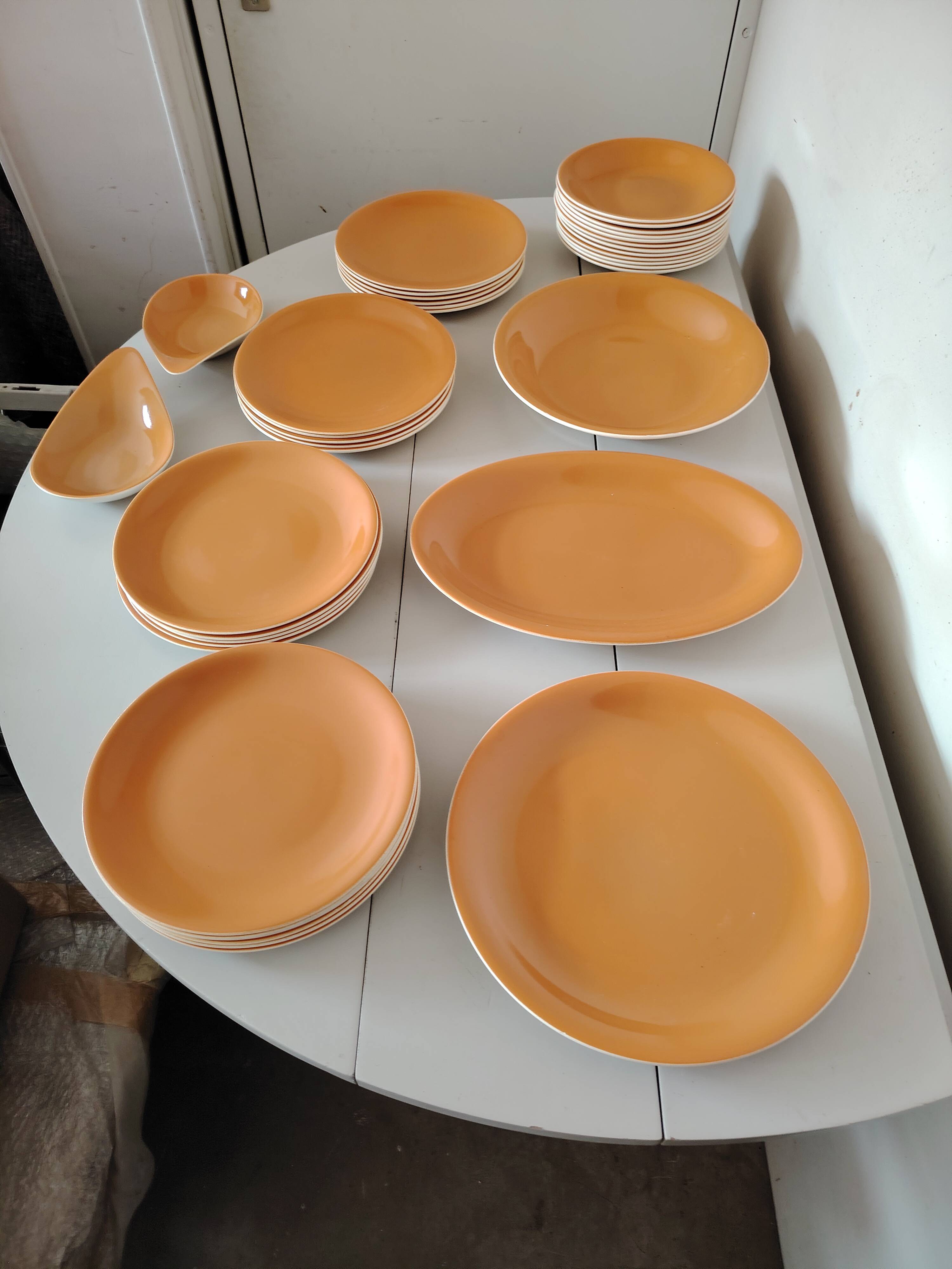 Orange dinner service from Salins