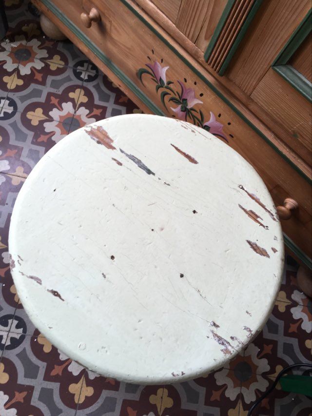 A rough wooden stool patinated by time